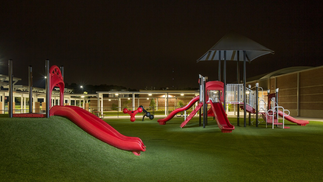 Nighttime artificial turf playground by Southwest Greens of New Mexico